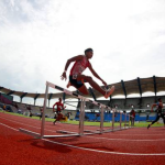 Muhammad Fakrul (dua, kanan) sedang berlumba dalam acara separuh akhir 400 meter (m) lari berpagar lelaki pada SUKMA 2024 Sarawak di Stadium Sarawak hari ini.